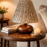Handcrafted wooden table lamp with floral pleated lampshade.